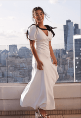 Velvet bow embellished white gown