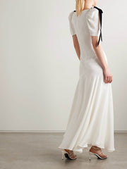 Velvet bow embellished white gown